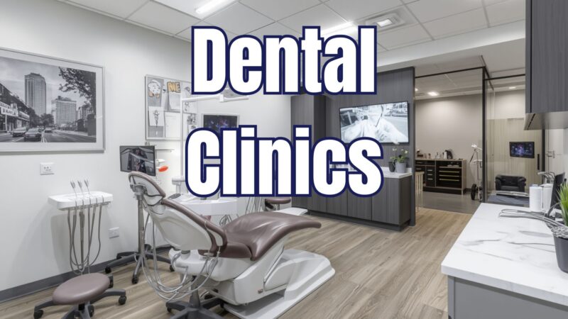 A modern dental clinic operatory room featuring a professional patient chair, dental equipment, and sleek gray cabinetry, with a prominent white text overlay reading "Dental Clinics" representing localized dental marketing solutions.