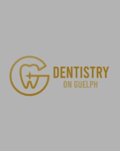 An elegant gold monogram logo featuring a circular outer emblem that encloses a stylized tooth illustration with a premium star sparkle on a solid gray background, showcasing a family dentistry and dental clinic portfolio feature optimized for authoritative content creation, organic social media management, and targeted Meta ads by MetaBaz.