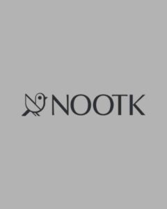 A minimalist dark grey logo featuring a stylized geometric bird icon and modern, clean typography on a solid gray background, showcasing a luxury home accessories brand portfolio feature optimized for premium social media management and high-conversion Meta ads by MetaBaz.