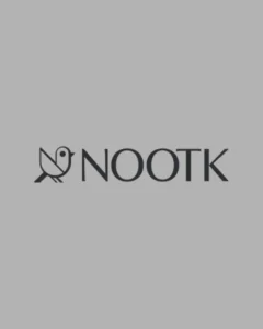 A minimalist dark grey logo featuring a stylized geometric bird icon and modern, clean typography on a solid gray background, showcasing a luxury home accessories brand portfolio feature optimized for premium social media management and high-conversion Meta ads by MetaBaz.
