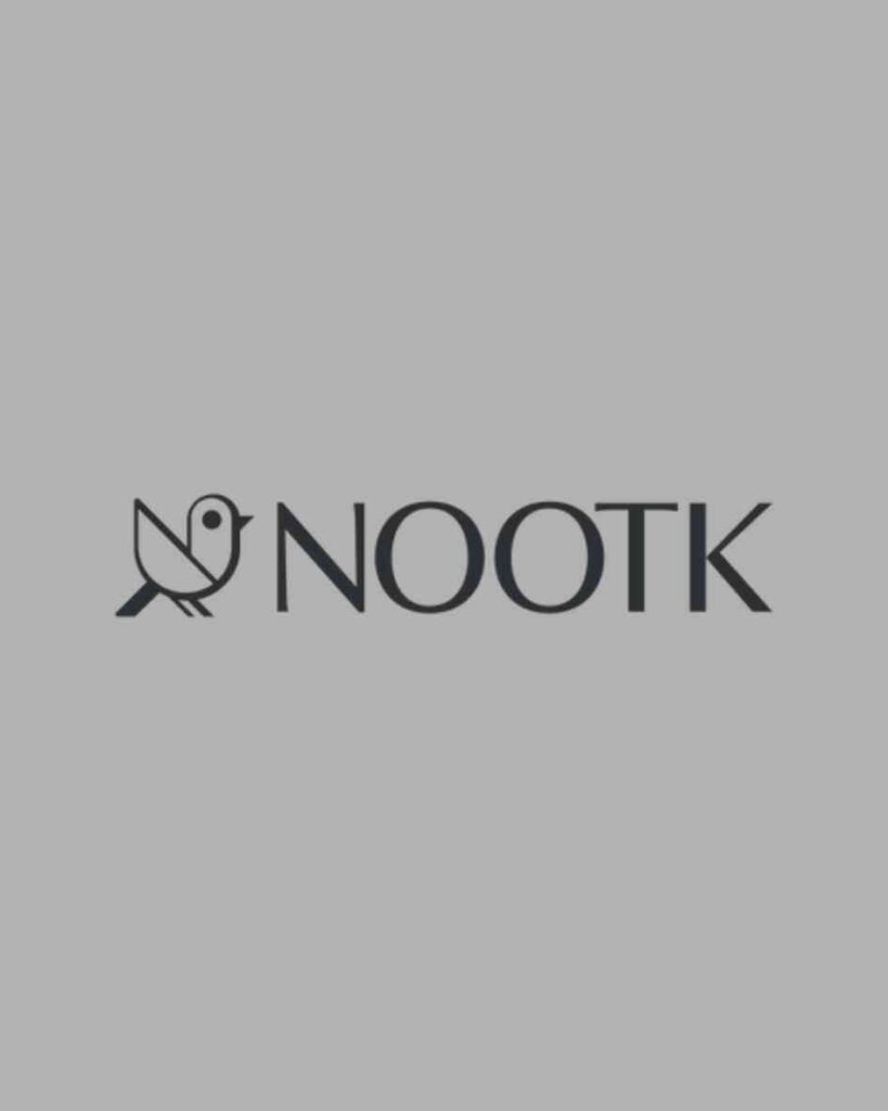 A minimalist dark grey logo featuring a stylized geometric bird icon and modern, clean typography on a solid gray background, showcasing a luxury home accessories brand portfolio feature optimized for premium social media management and high-conversion Meta ads by MetaBaz.
